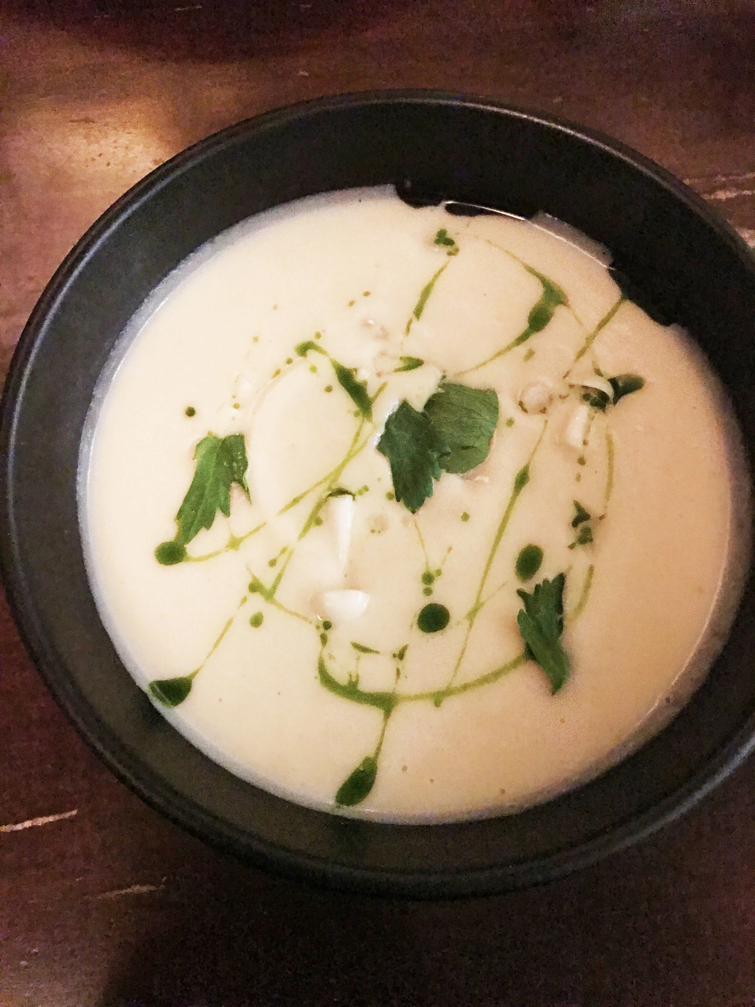Celariac and apple veloute with pickled salsify, shimeji, and lovage oil