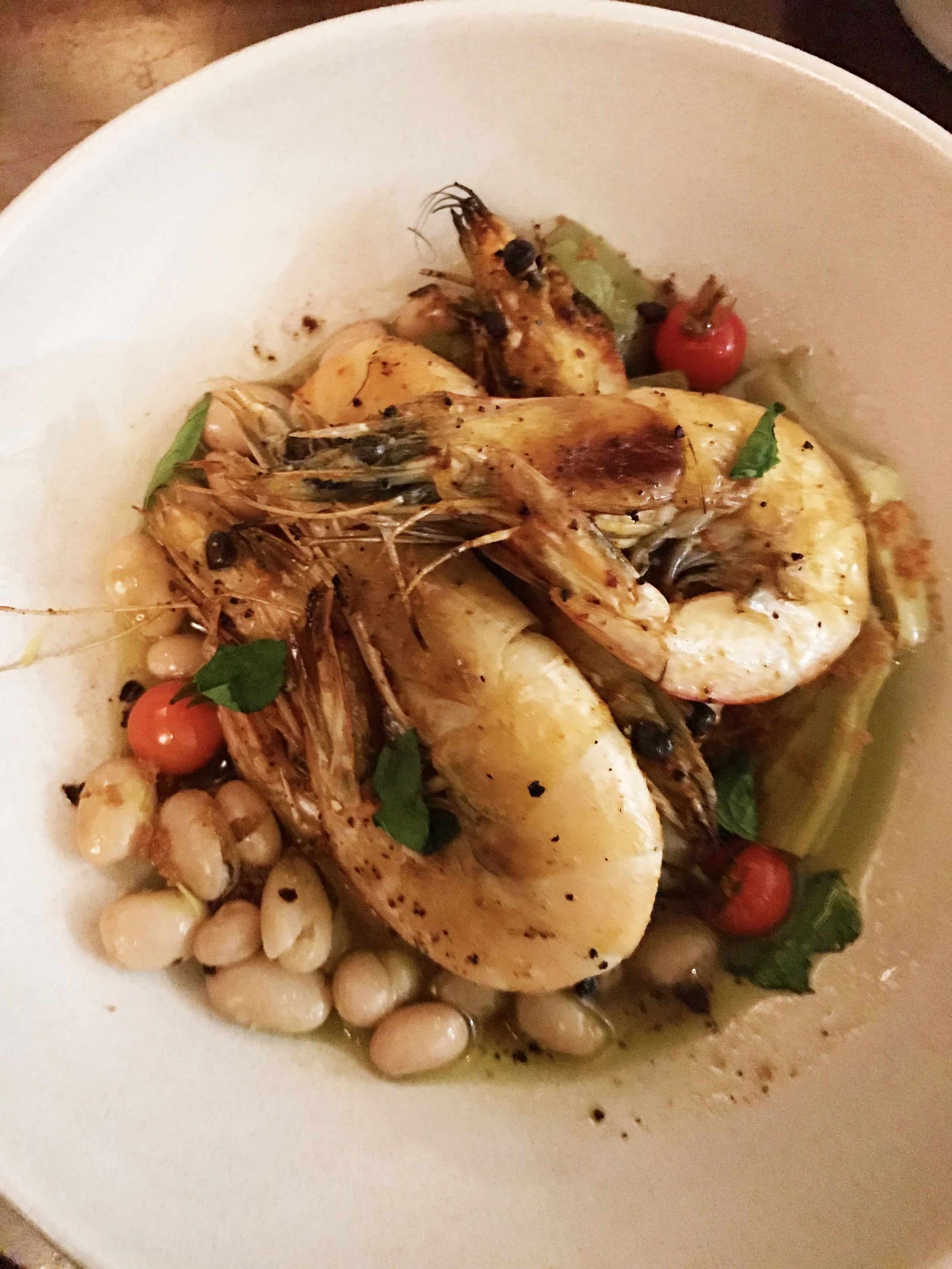 Banana prawns with artichoke barigoule, cranberry beans, and tomato