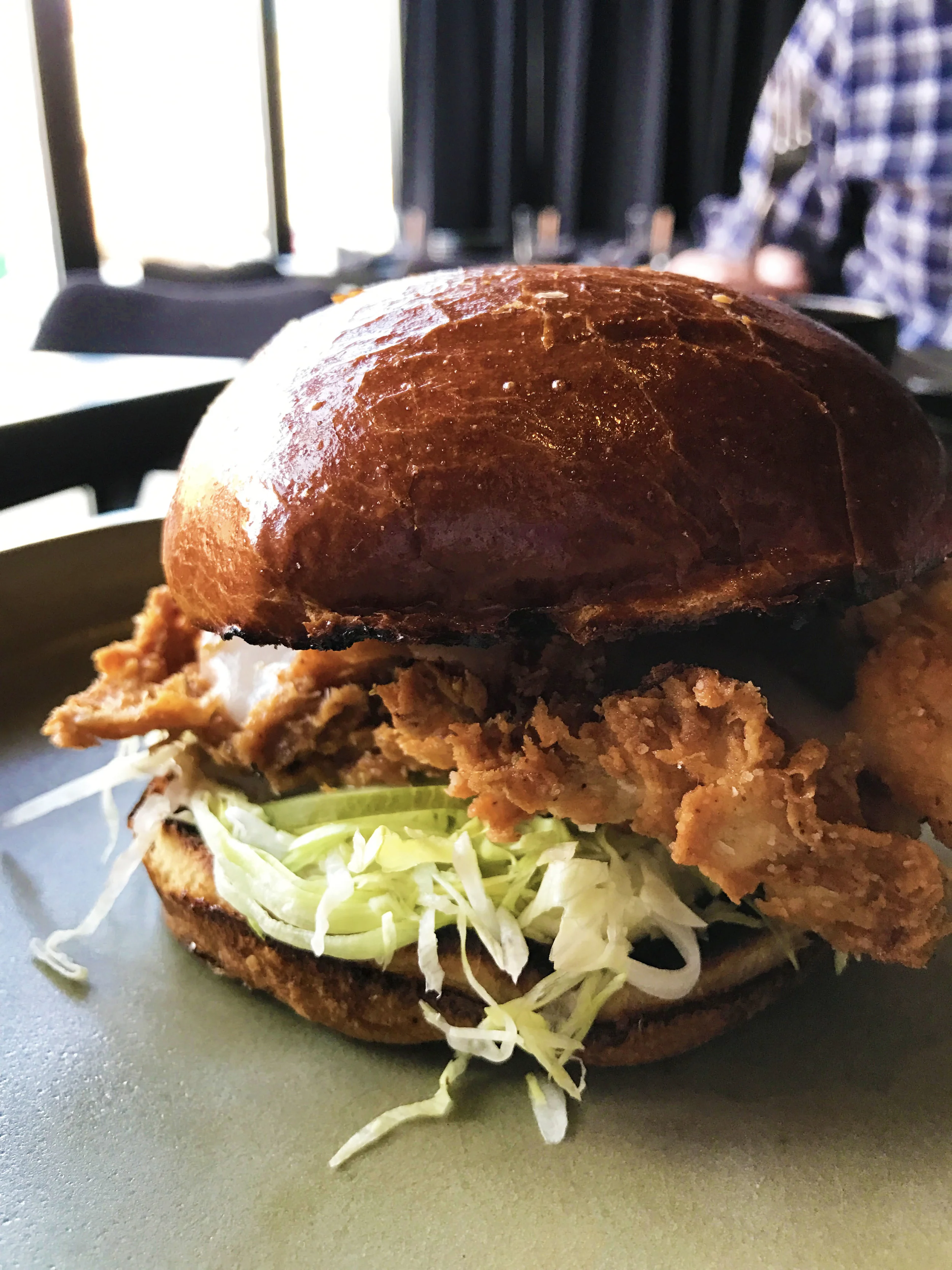 Fried Chicken Sandwich with sunchoke hot sauce and chamomile mayo.