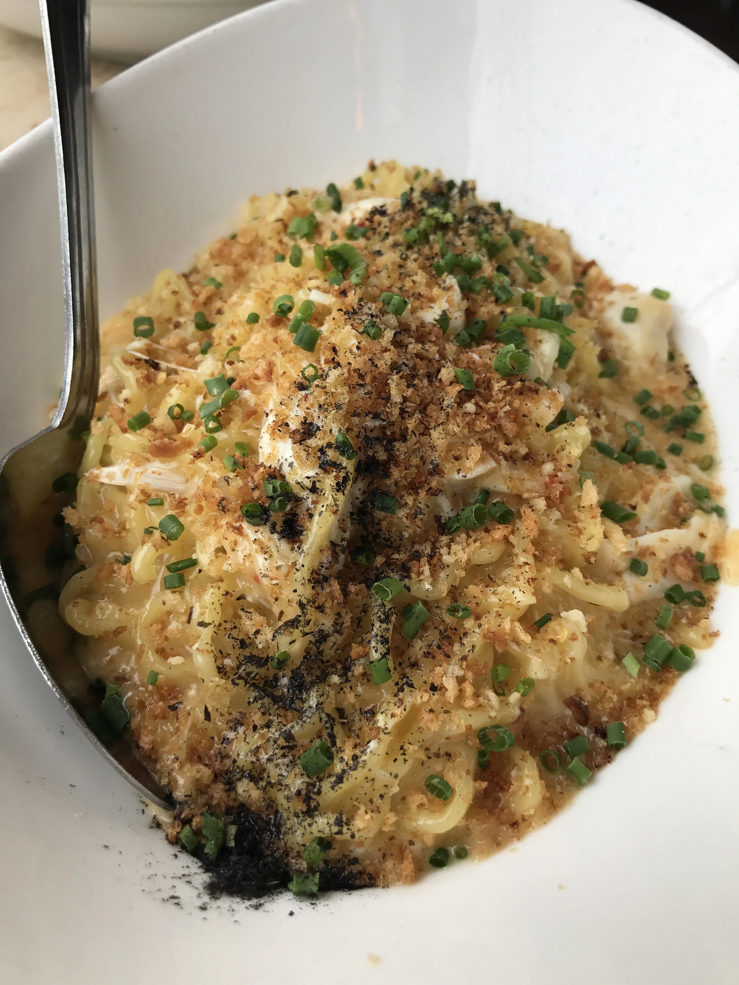 Crab & Uni Sashimi with lump crab, Hannah's noodles, homemade panko, chives, nori, and fresh uni sashimi