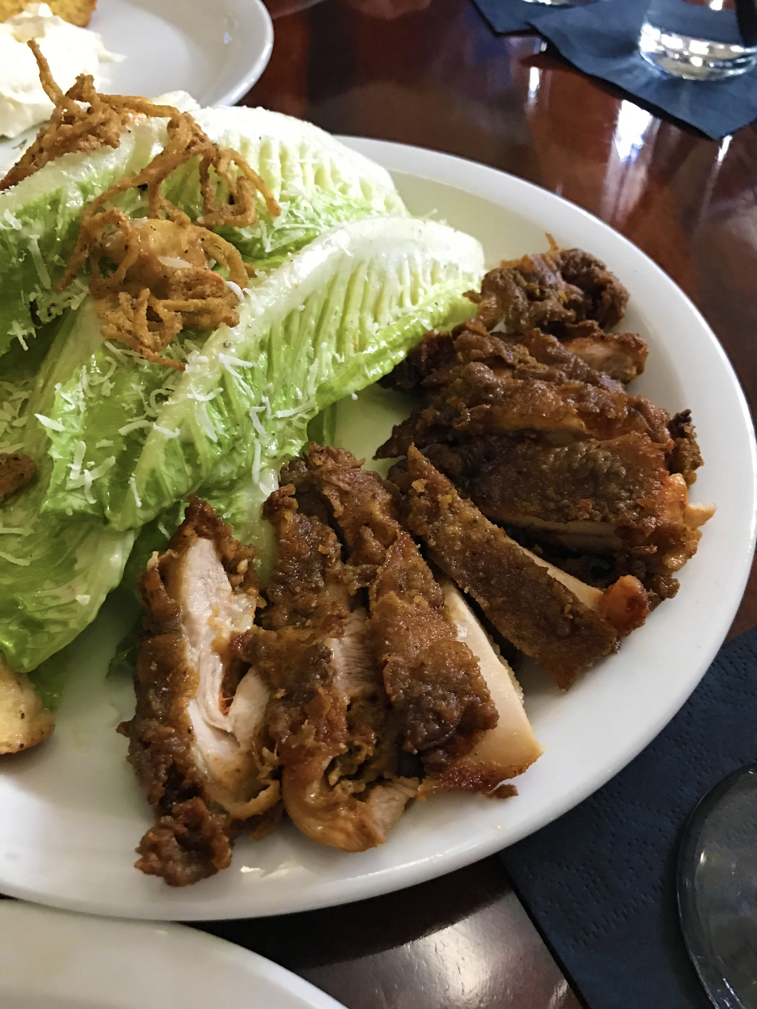 Romaine hearts with buttermilk Caesar, fried chicken, and crisp shallot