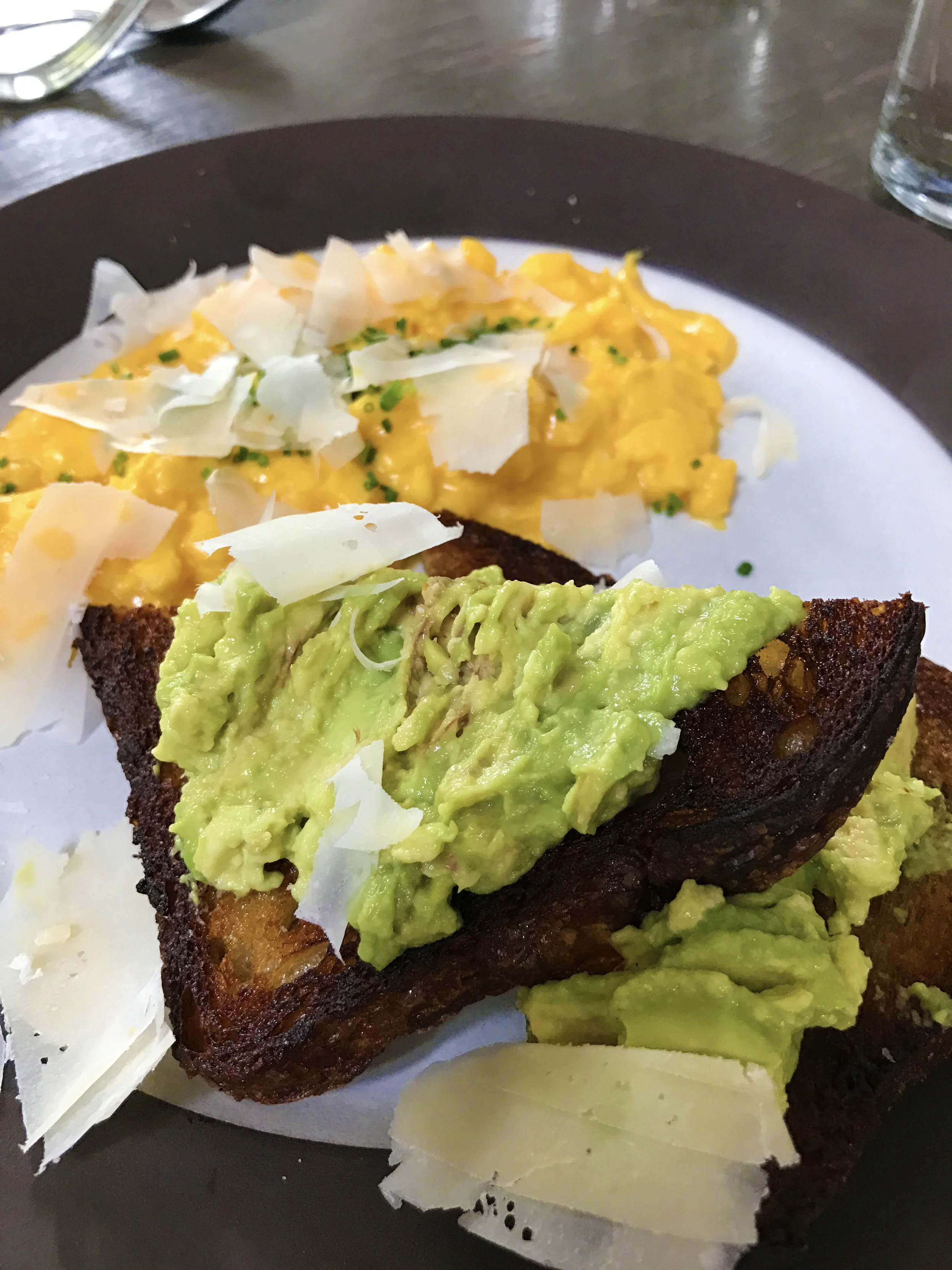 Soft scramble and avocado toast with parmesan and chives