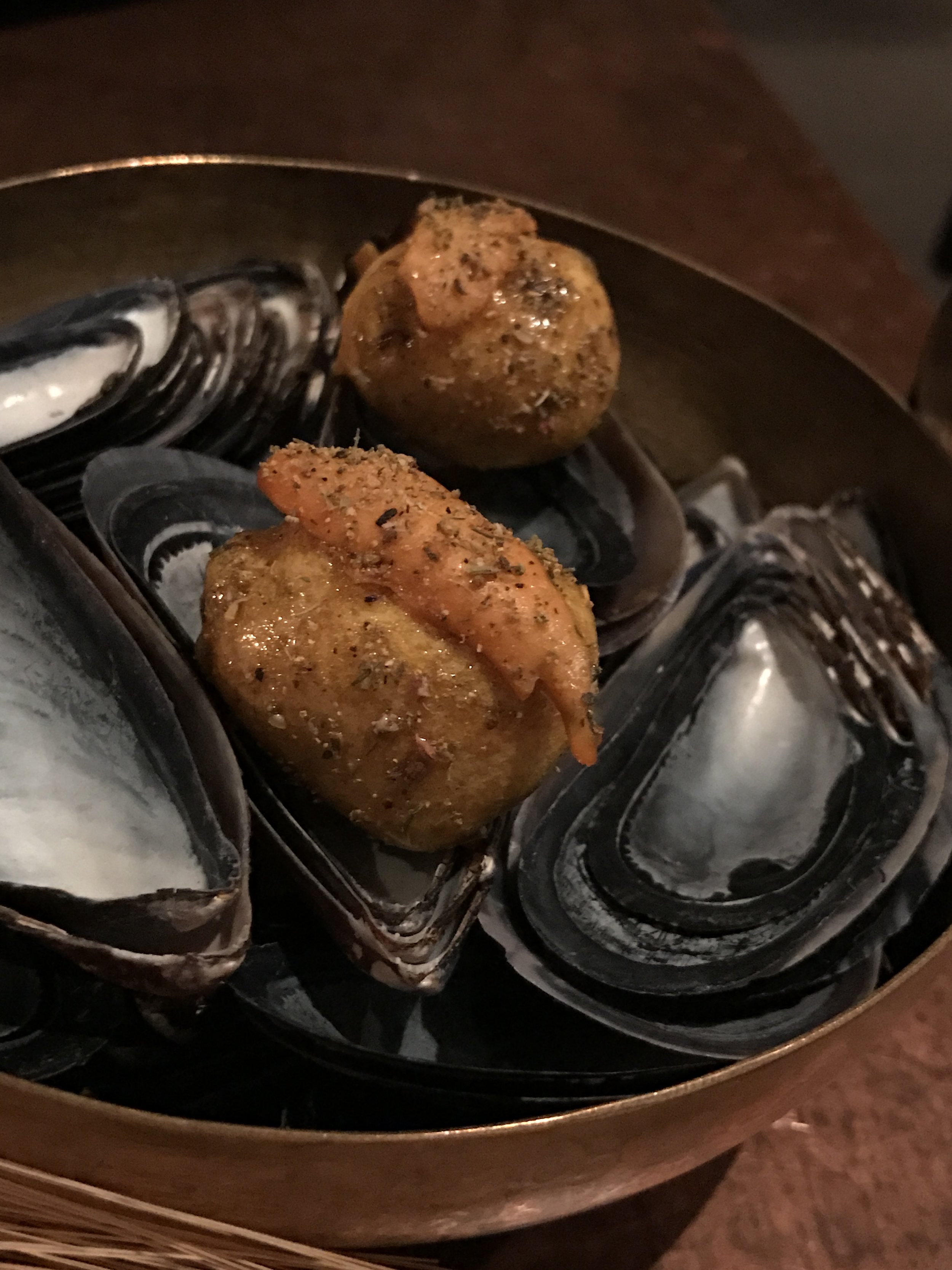 Mussels "croquette" with hints of anise, saffron, lardo, and honey