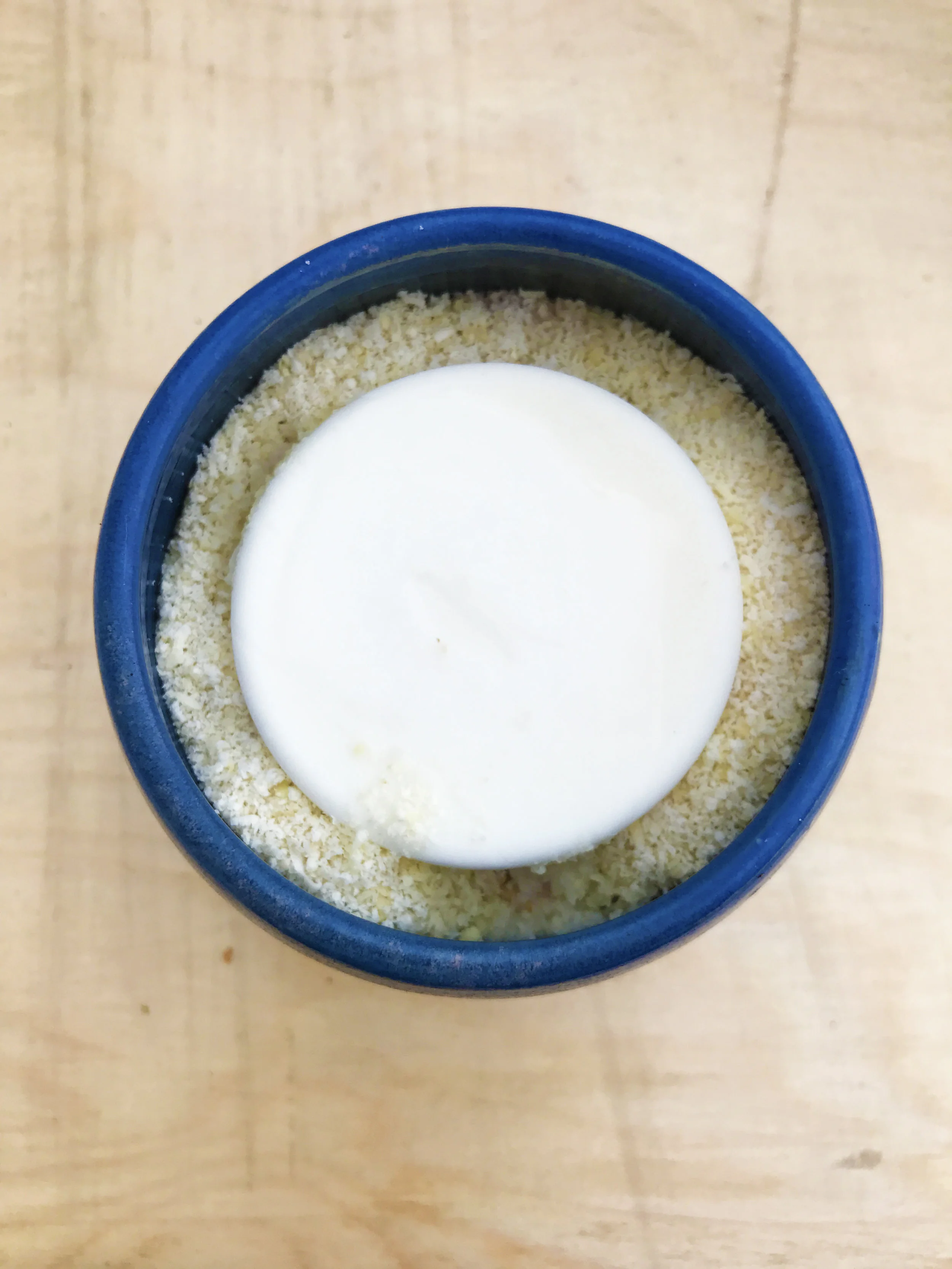Raw oatmeal, almond milk, red currant, vanilla, and a frozen disk of skyr Icelandic yogurt