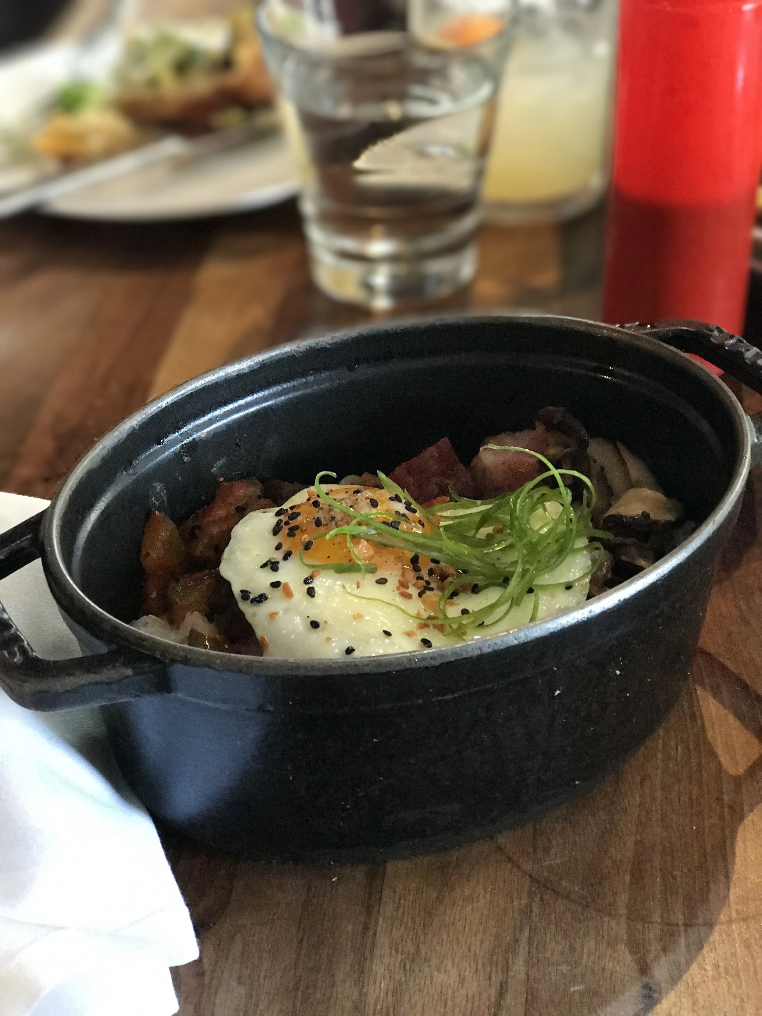 Bimbimbap with pork belly, mushroom, bean sprouts, gochojang, and sunny egg