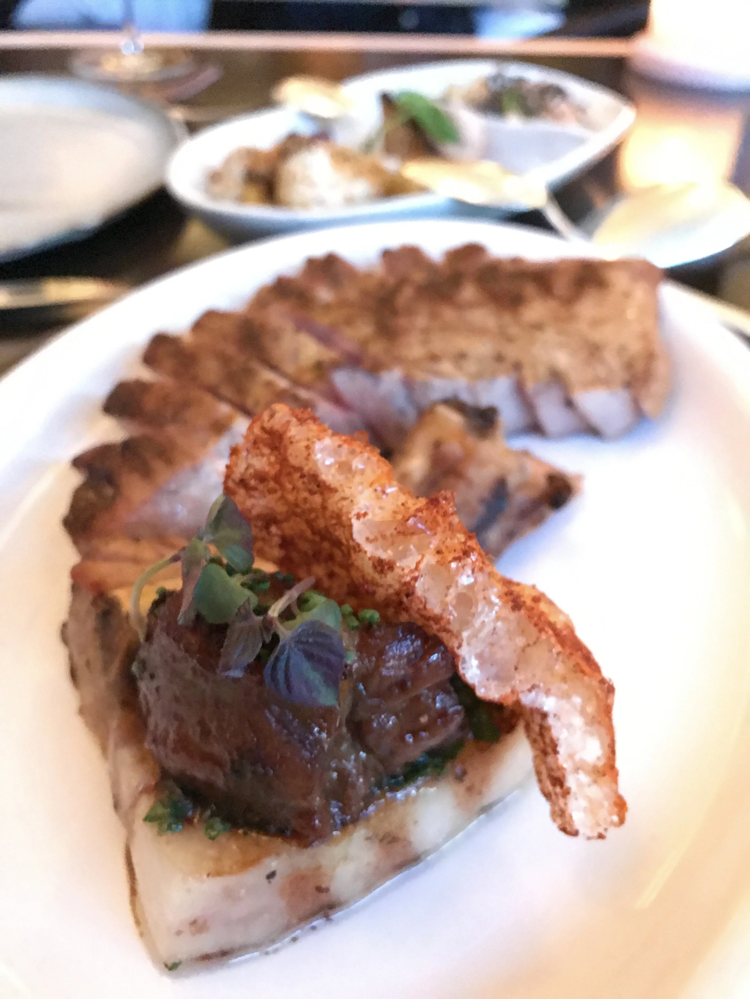 Fire Roasted Pork - glazed cheek, grilled rack, and smoked belly