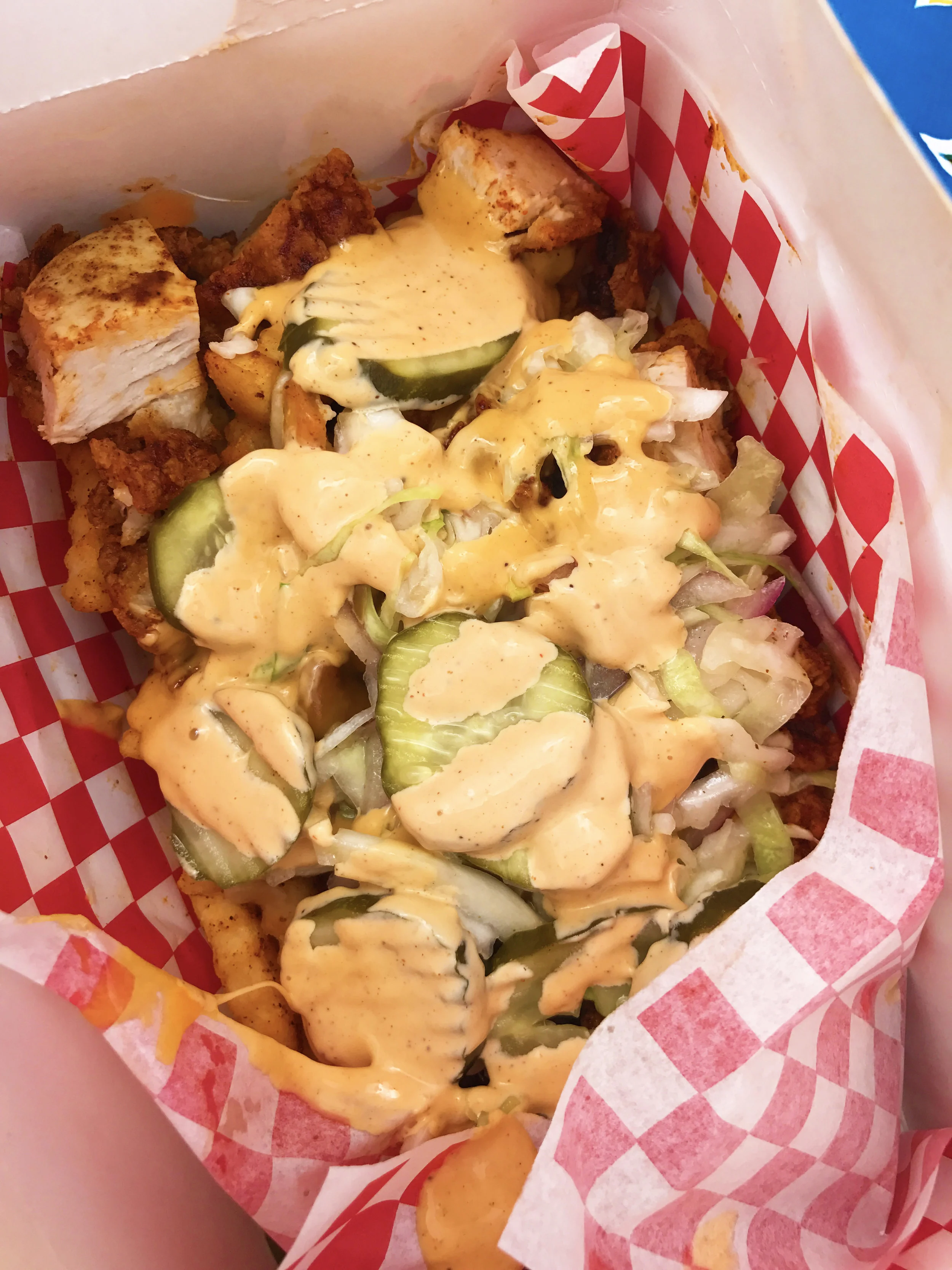 Hot Shake Fries served Mario Style (with pickles, slaw, comeback sauce, and medium spicy chicken)
