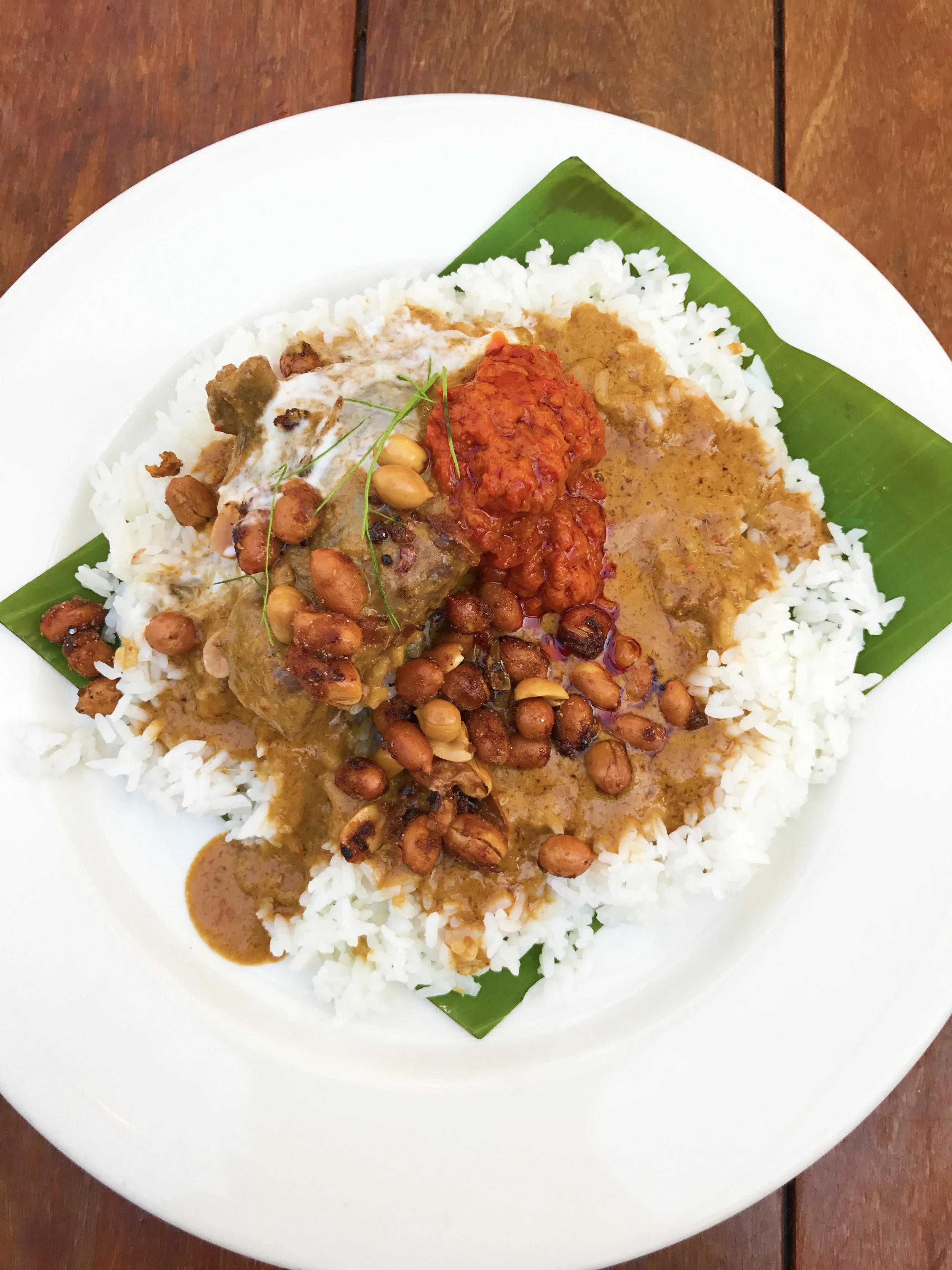 Beef Rendang with beef cheek curry jasmine rice, sambal, kaffir lime, and peanuts