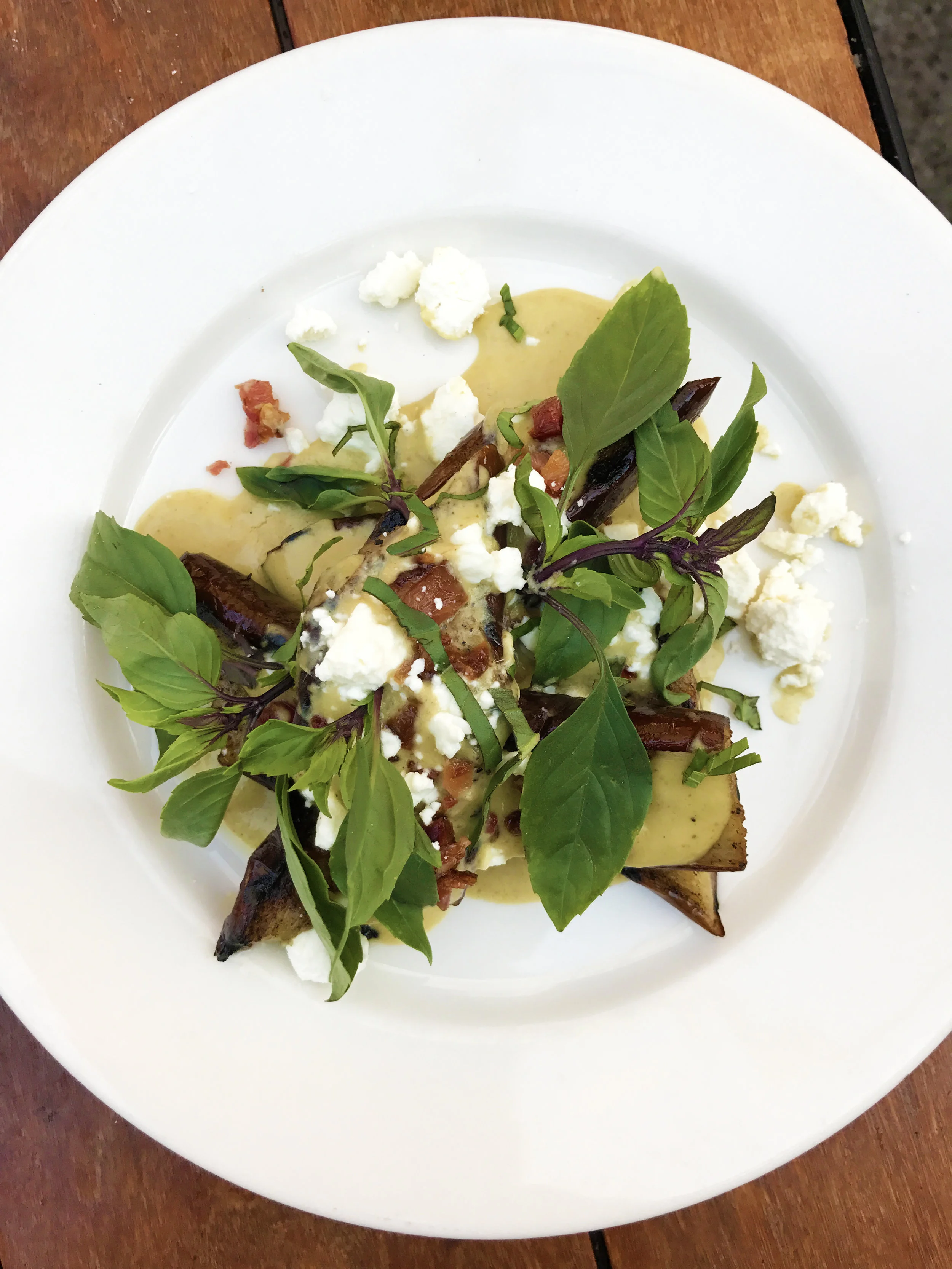 Grilled Eggplant with lemongrass curry, applewood smoked bacon, sheep cheese, and Asian basil