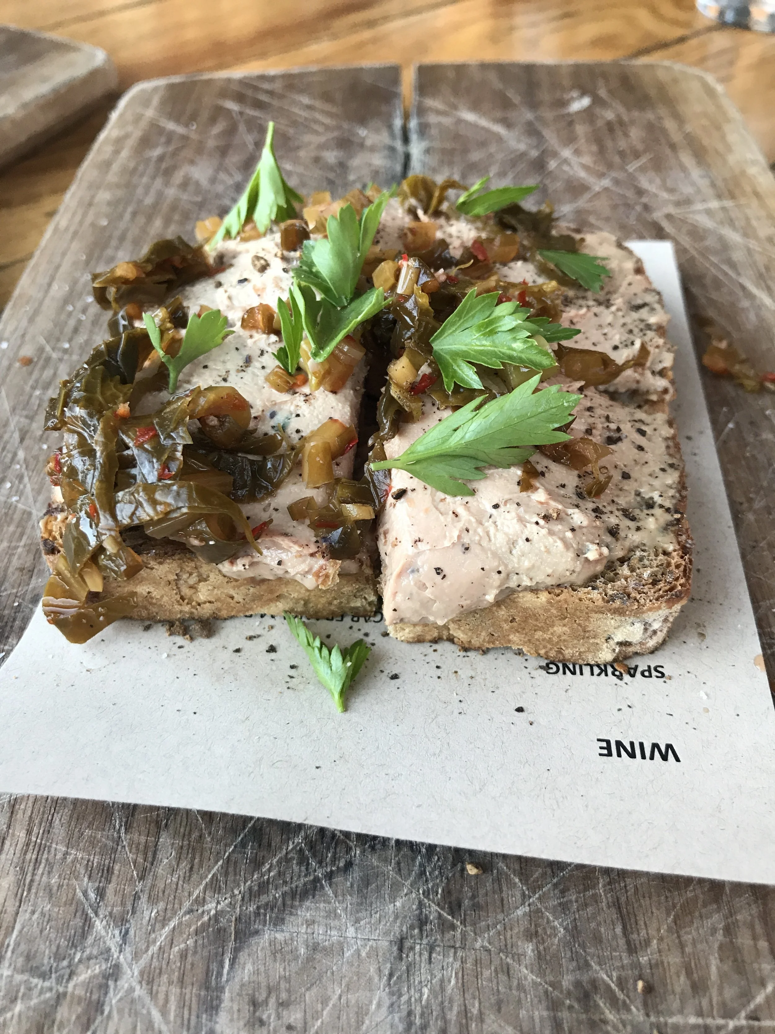 Chicken liver toast with spicy fermented greens and seeded toast
