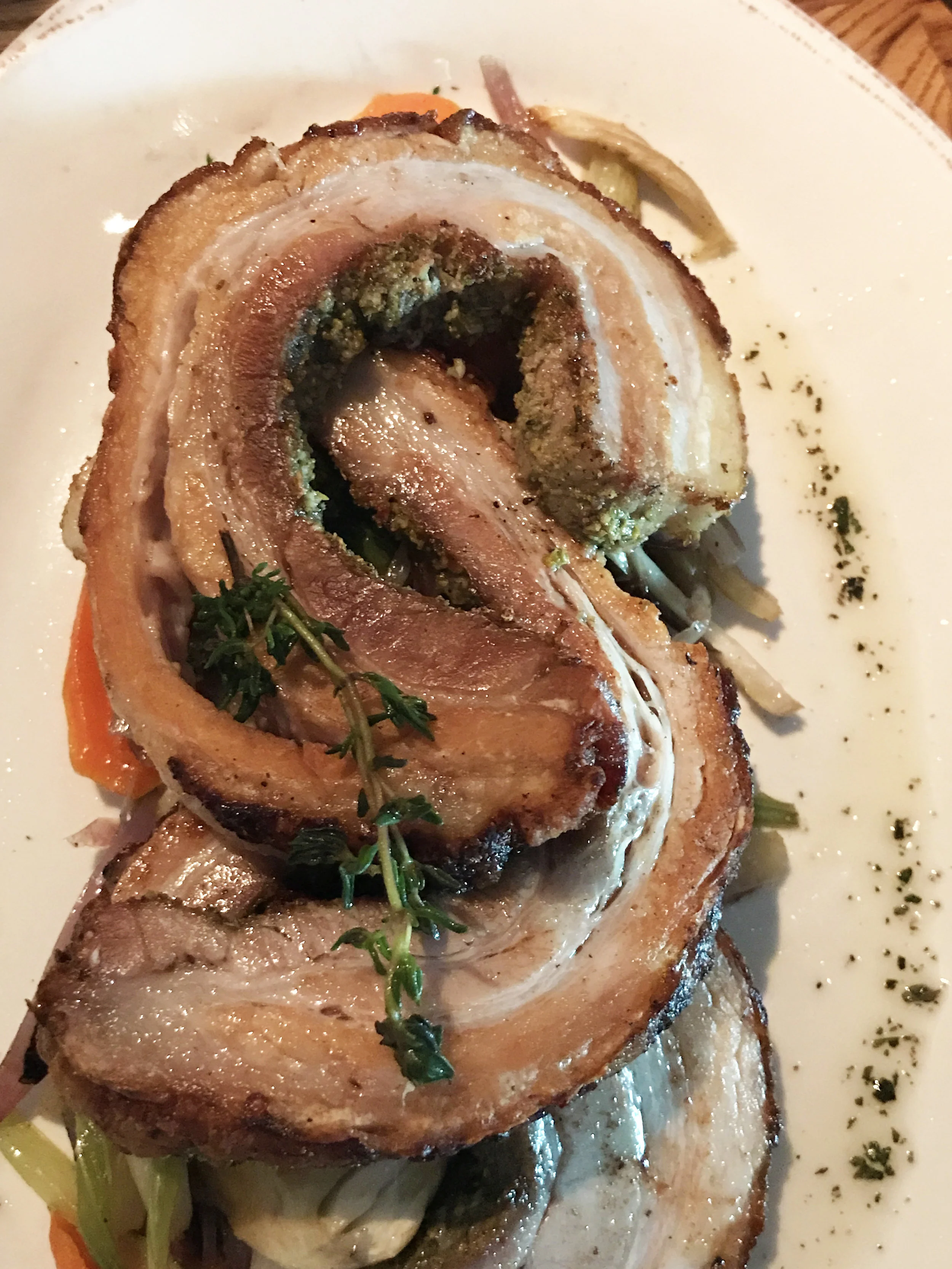 Porchetta - rolled pork belly, aromatic herbs, red onions, carrots, fennel, celery