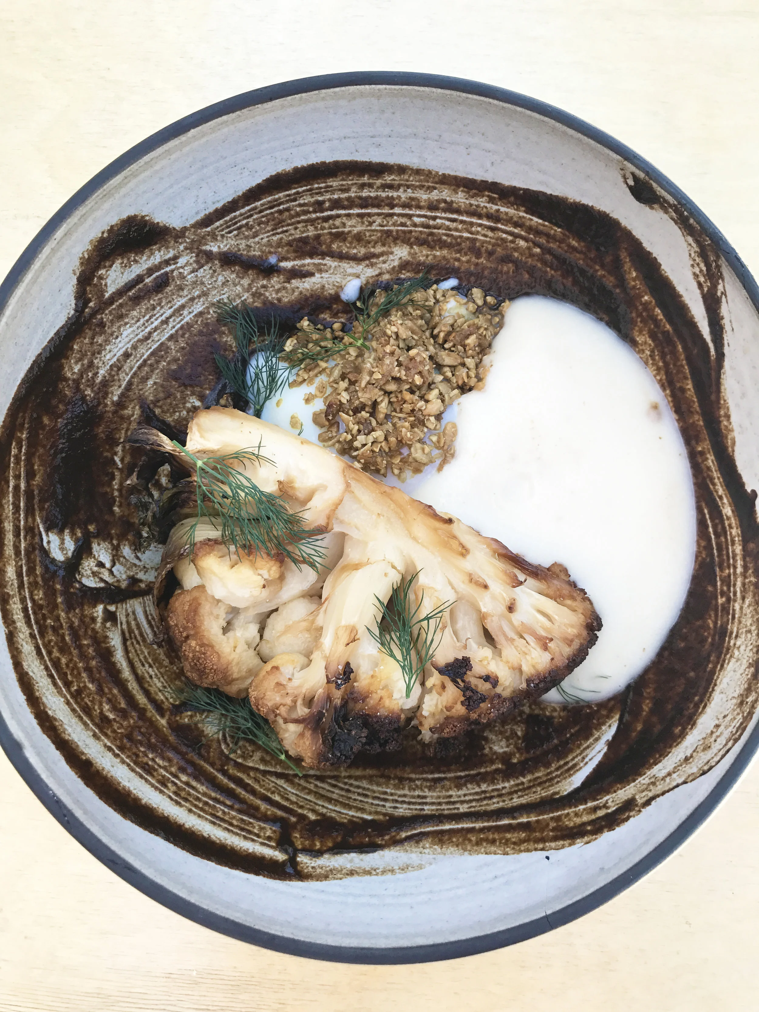 Roasted cauliflower, poached egg, black garlic, chicken skin