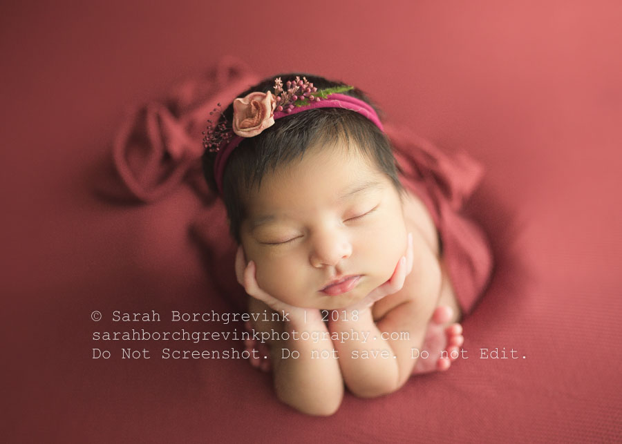 Vibrant red backdrop in froggy pose