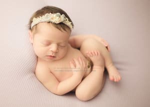 Back to sleep pose in newborn photography