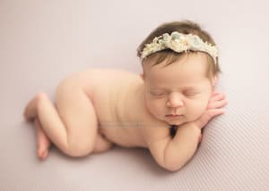 Side sleeper lay pose newborn portraits