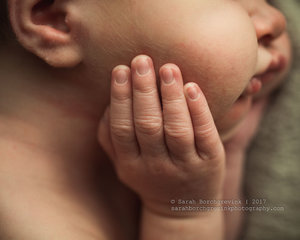 Macro detail image of newborn fingers and hands