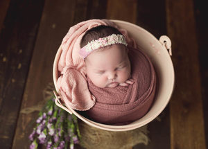 Baby in a Pink Bucket