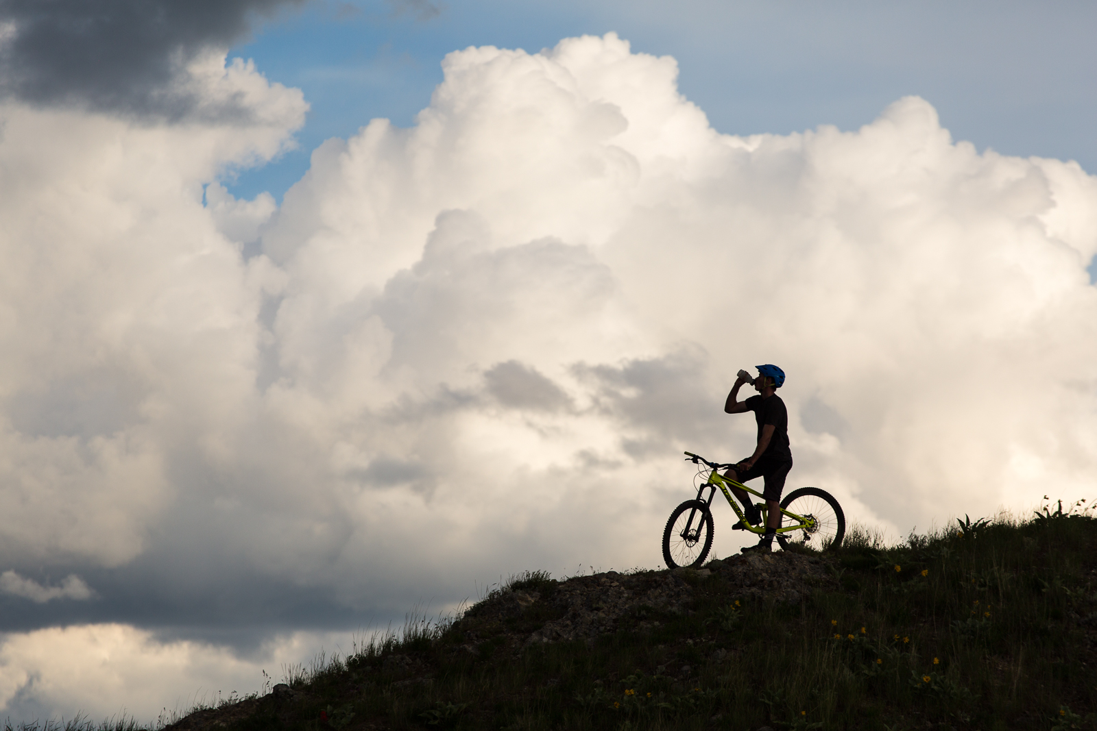 Man drinking water while riding his mountain bike in Utah