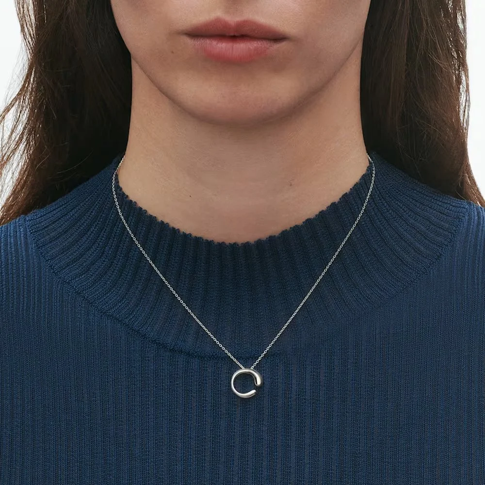 MERCY PENDANT ON MODEL.jpg