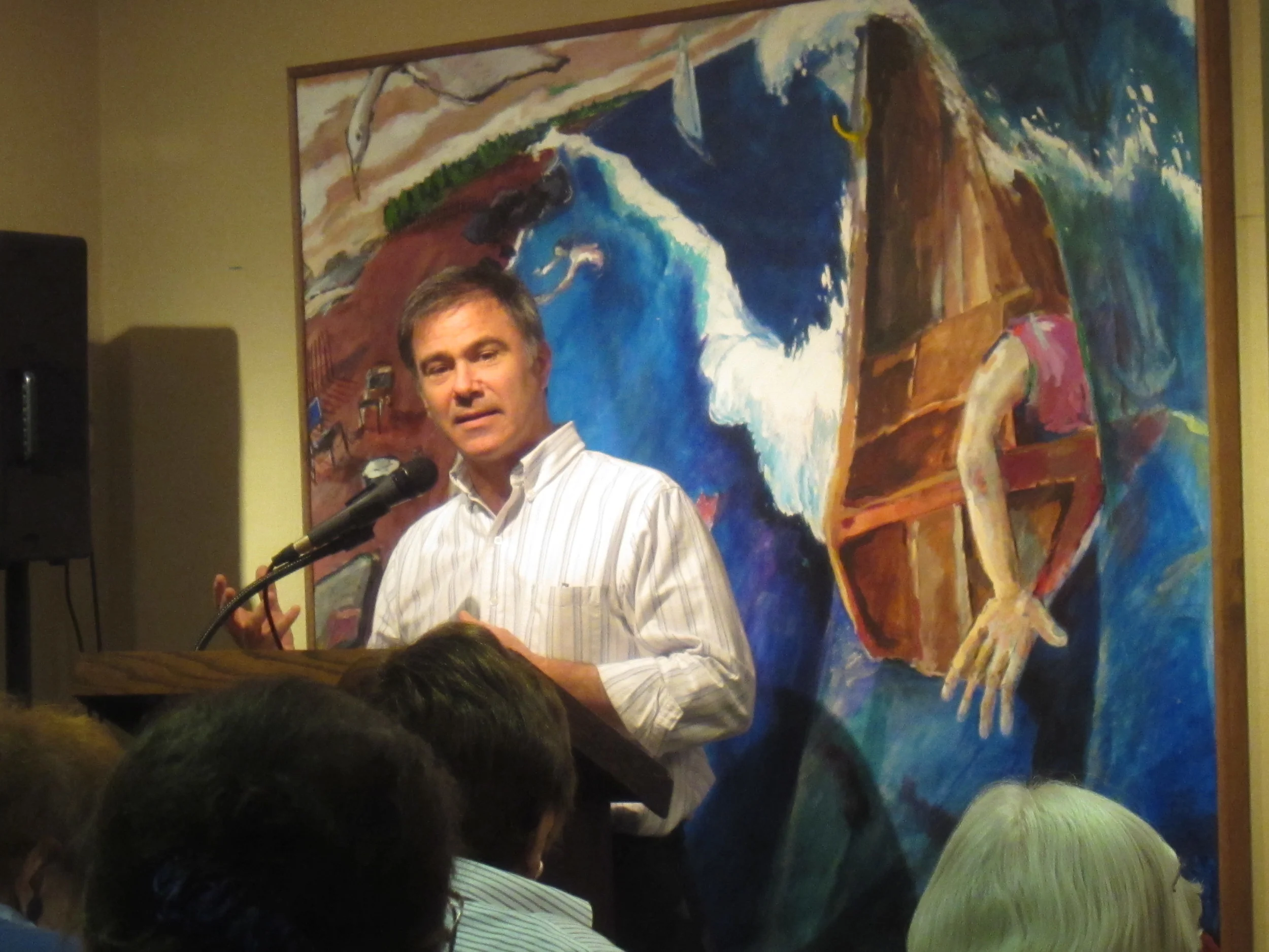 Photo by Ron Abbe This is a photo of me discussing my work at the Watermark Gallery in Bridgeport, CT. In this solo exhibition I exhibited 22 pieces and gave a brief presentation at the opening reception. The painting behind me is Ebb Tide.