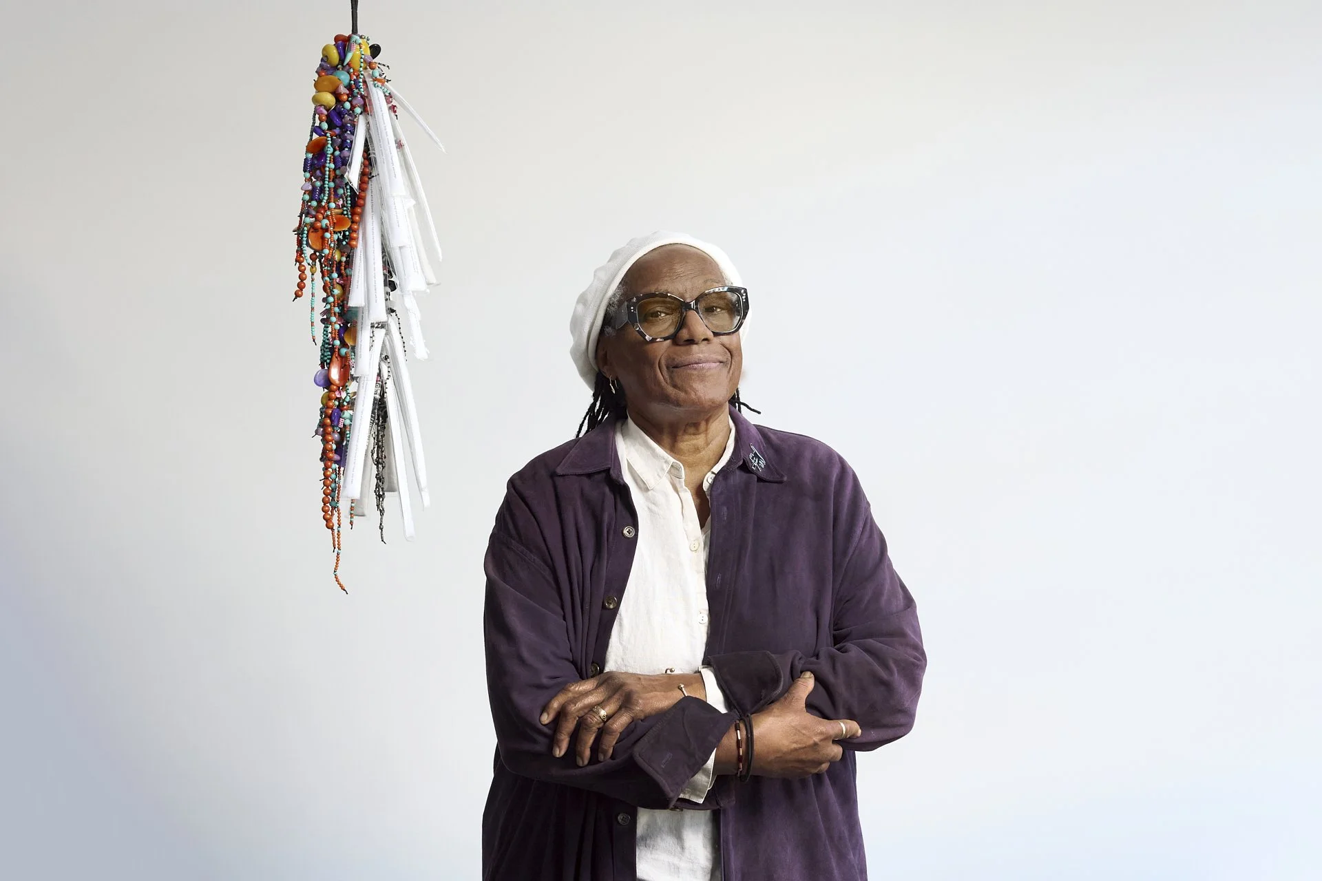Editorial portrait of artist Janet Olivia Henry with one of her mixed-media works at Gordon Robichaux, New York, by Christopher Garcia Valle