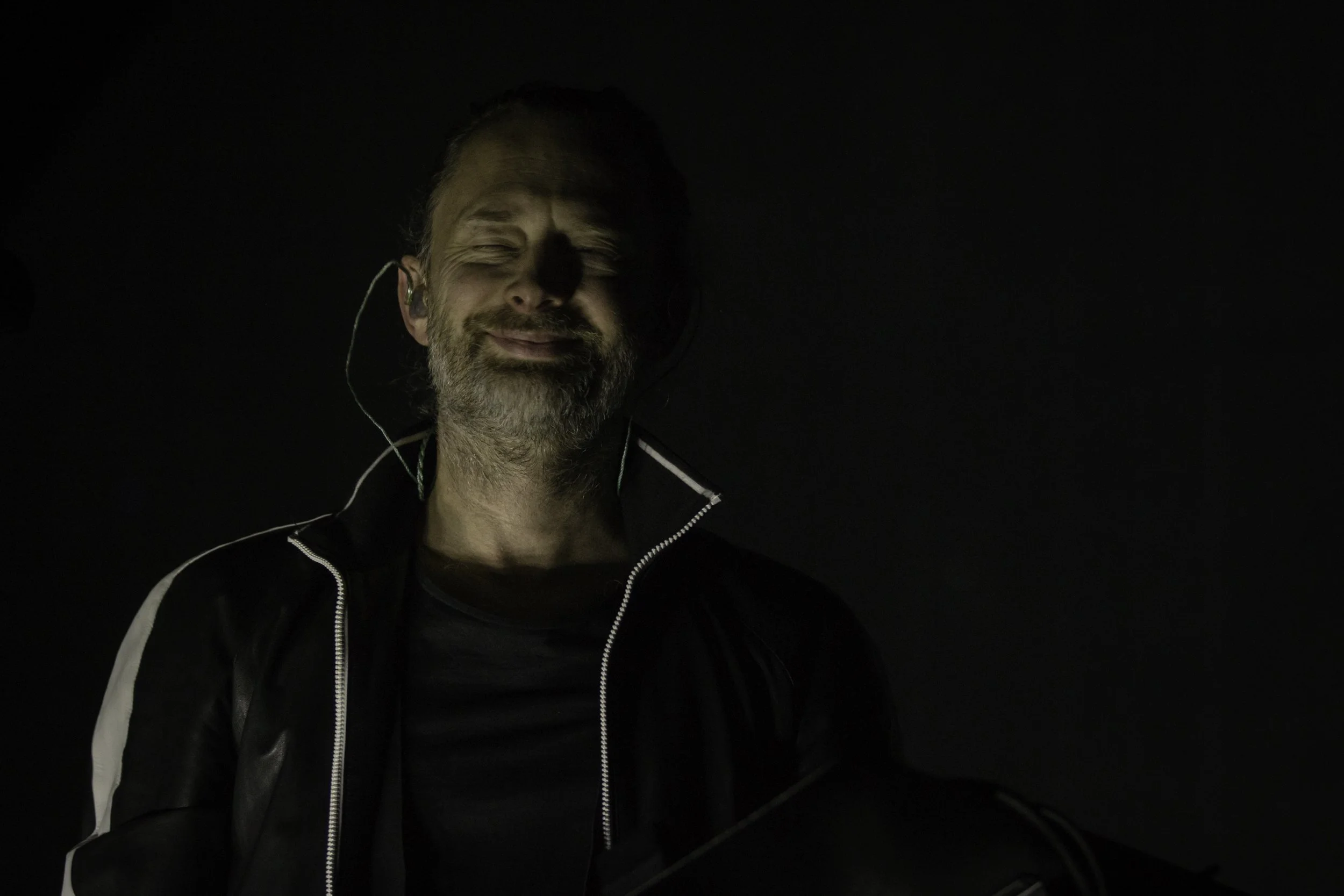 Concert photograph of Thom Yorke of Radiohead performing at the Moda Center, Portland, 2017, photographed by Christopher Garcia Valle