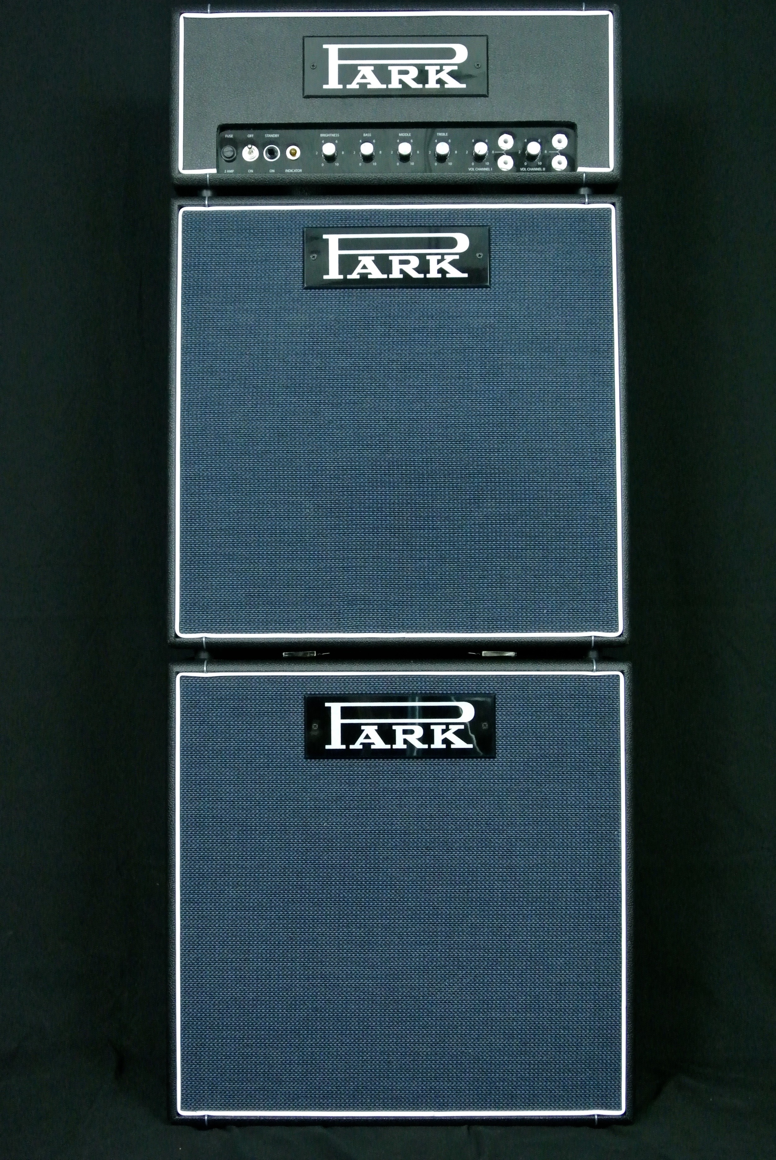 Park Little Stack. Park Little Head 18 with PLCT (Park Little Cab Top) and PLCB (Park Little Cab Bottom). Each houses one Celestion G12-65 Creamback M 12", 16 ohm speaker). Little cabs are 21" x 21". The top cab is slightly angled back. The bottom depth is 11". The top depth is 9.5".