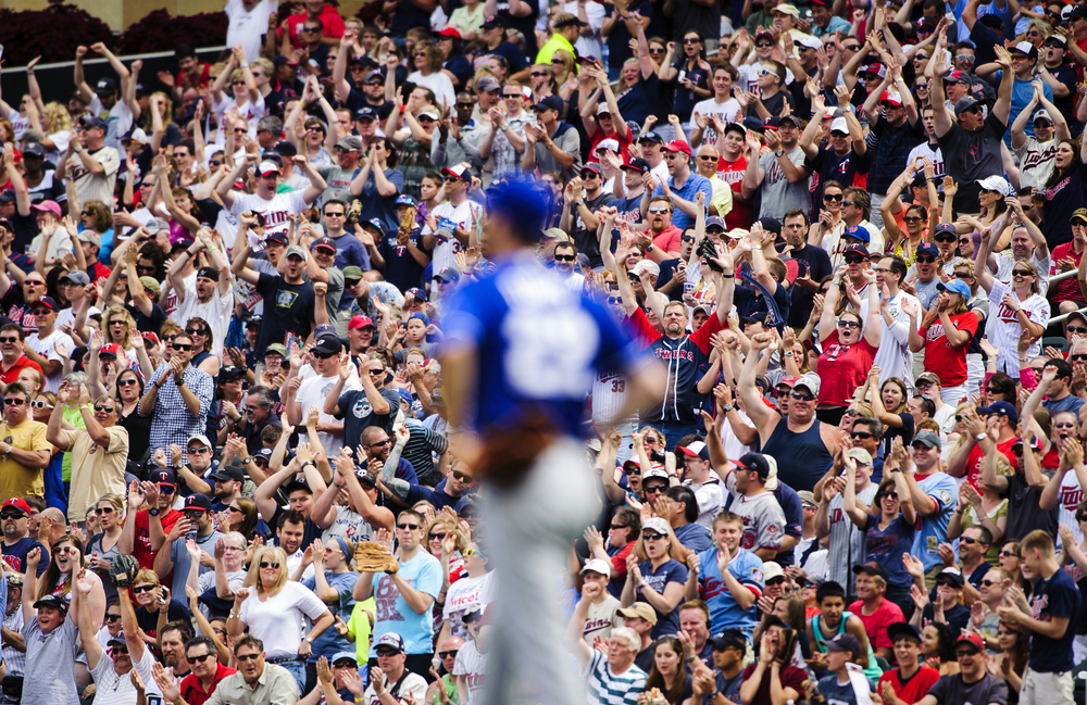  Wade Davis #22 of the Kansas City Royals reacts to giving up a two run home run to Trevor Plouffe #24 of the Minnesota Twins as fans cheer during the first inning of the game on June 29, 2013 at Target Field in Minneapolis, Minnesota.   (Photo by Ha