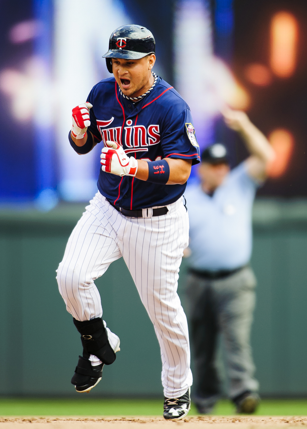  Oswaldo Arcia #31 of the Minnesota Twins celebrates as he rounds the bases as second base umpire Bob Davidson #61 signals a home run during the seventh inning of the game between the Minnesota Twins and the Houston Astros on August 4, 2013 at Target