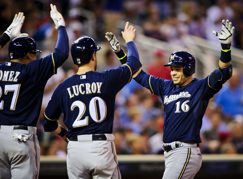  Carlos Gomez #27 and Jonathan Lucroy #20 of the Milwaukee Brewers congratulate teammate Aramis Ramirez #16 on a three-run home run against the Minnesota Twins during the seventh inning of the game on June 4, 2014 at Target Field in Minneapolis, Minn