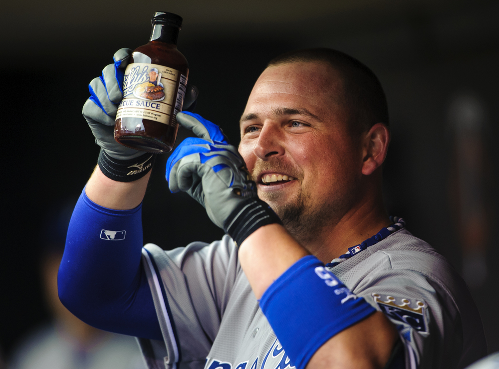  Billy Butler #16 of the Kansas City Royals holds up a bottle of Billy's Hot Sauce after hitting a home run against the Minnesota Twins during the game on June 28, 2013 at Target Field in Minneapolis, Minnesota.   (Photo by Hannah Foslien/Getty Image