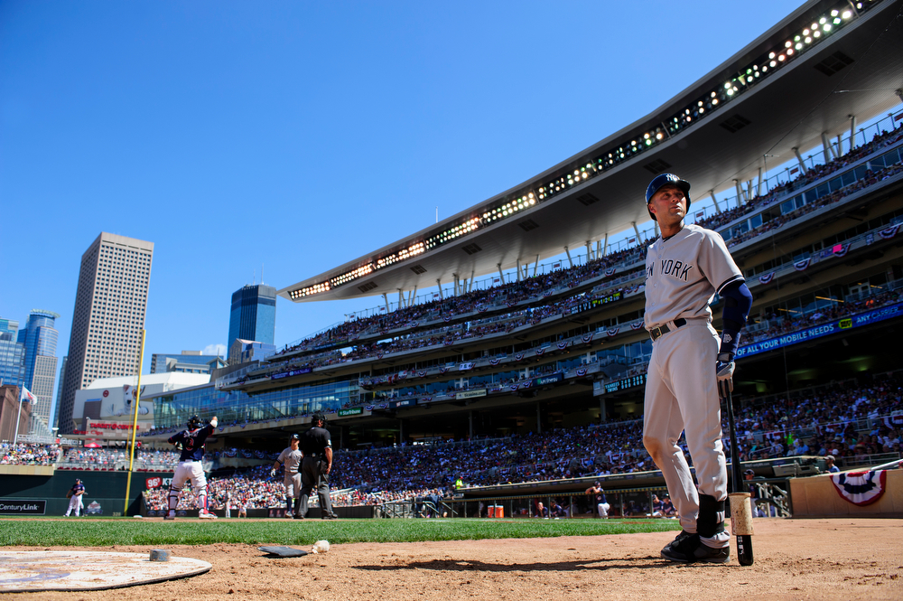  Derek Jeter #2 of the New York Yankees looks on while waiting on deck to bat against the Minnesota Twins during the game on July 6, 2014 at Target Field in Minneapolis, Minnesota. The Yankees defeated the Twins 9-7.   (Photo by Hannah Foslien/Getty 