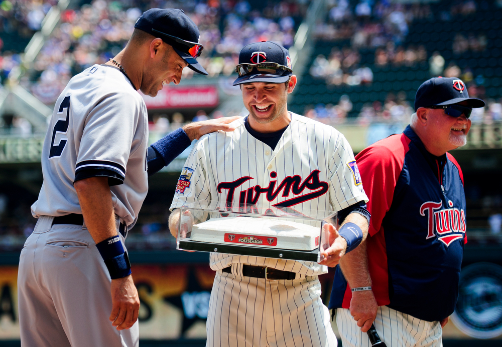  Brian Dozier #2 of the Minnesota Twins presents Derek Jeter #2 of the New York Yankees with the last second base used at the Metrodome before the game on July 5, 2014 at Target Field in Minneapolis, Minnesota.   (Photo by Hannah Foslien/Getty Images