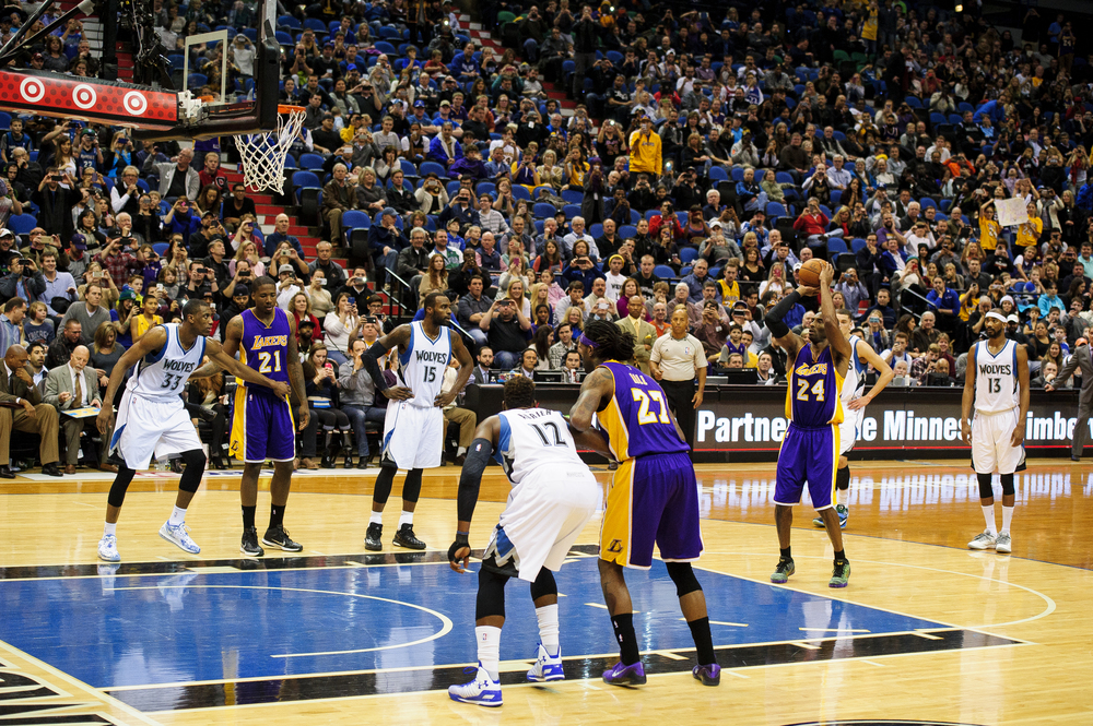  Kobe Bryant #24 of the Los Angeles Lakers shoots a free throw to pass Michael Jordan on the all-time NBA scoring list during the second quarter of the game on December 14, 2014 at Target Center in Minneapolis, Minnesota.  (Photo by Hannah Foslien/Ge