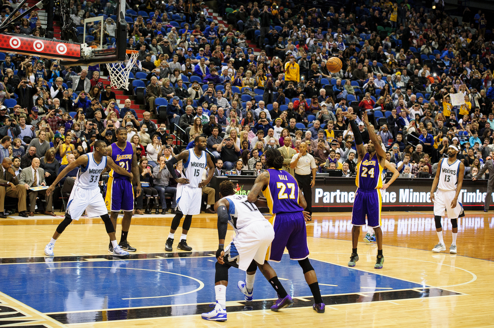  Kobe Bryant #24 of the Los Angeles Lakers shoots a free throw to pass Michael Jordan on the all-time NBA scoring list during the second quarter of the game on December 14, 2014 at Target Center in Minneapolis, Minnesota.  (Photo by Hannah Foslien/Ge