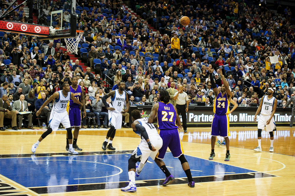  Kobe Bryant #24 of the Los Angeles Lakers shoots a free throw to pass Michael Jordan on the all-time NBA scoring list during the second quarter of the game on December 14, 2014 at Target Center in Minneapolis, Minnesota.  (Photo by Hannah Foslien/Ge