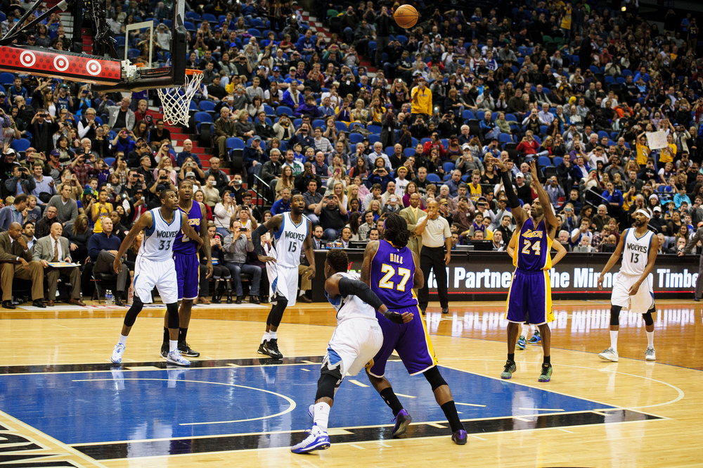  Kobe Bryant #24 of the Los Angeles Lakers shoots a free throw to pass Michael Jordan on the all-time NBA scoring list during the second quarter of the game on December 14, 2014 at Target Center in Minneapolis, Minnesota.  (Photo by Hannah Foslien/Ge