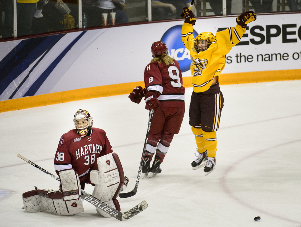  Minnesota forward Meghan Lorence (20), right, celebrates a goal as Harvard goalie Emerance Maschmeyer (38) and forward Lyndsey Fry (9) watch during the third period of an NCAA women's Frozen Four championship college hockey game Sunday, March 22, 20