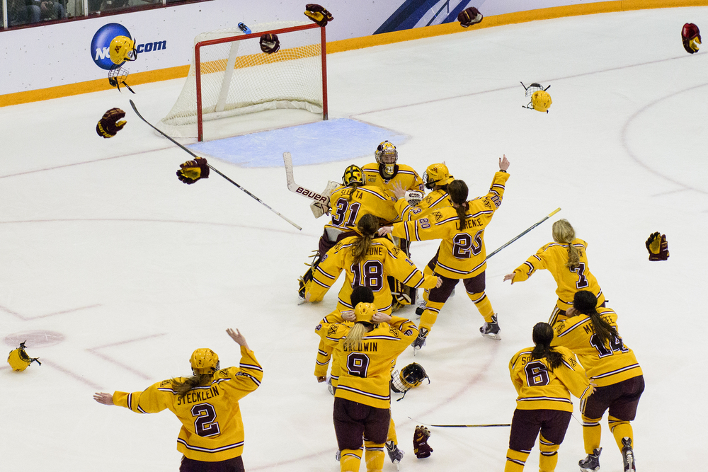  Minnesota celebrates a win of an NCAA women's Frozen Four championship college hockey game against Harvard Sunday, March 22, 2015, in Minneapolis. Minnesota won 4-1.   (AP Photo/Hannah Foslien)  