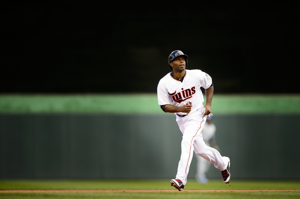  Torii Hunter #48 of the Minnesota Twins runs the base path between second and third base against the Kansas City Royals during the home opening game on April 13, 2015 at Target Field in Minneapolis, Minnesota.   (Photo by Hannah Foslien/Getty Images