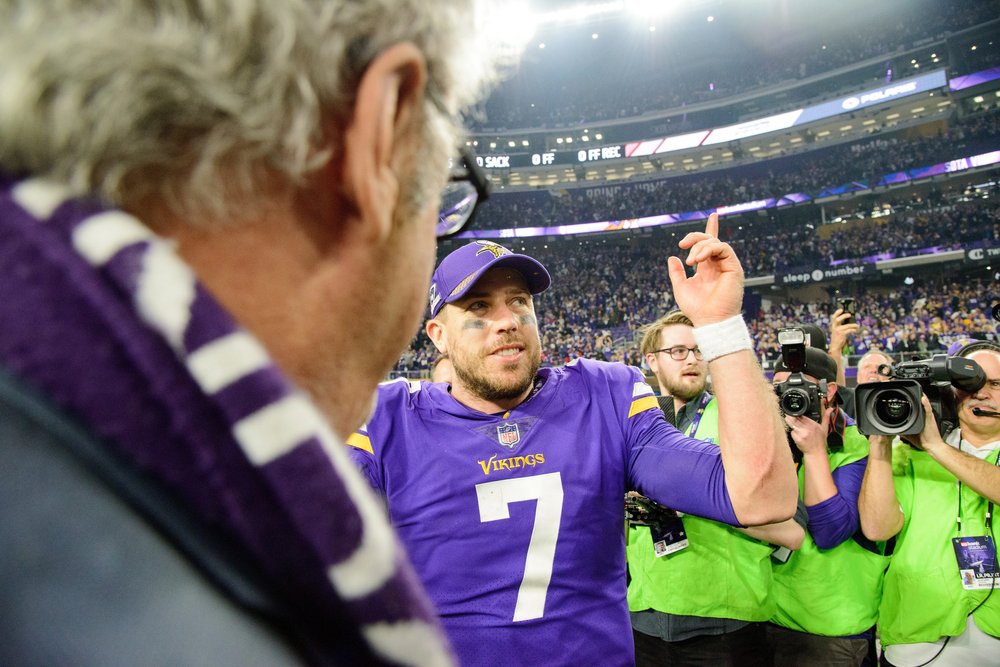  MINNEAPOLIS, MN - JANUARY 14: Case Keenum #7 of the Minnesota Vikings speaks to owner Zygi Wilf after defeating the New Orleans Saints 29-24 in the NFC Divisional Playoff game on January 14, 2018 at U.S. Bank Stadium in Minneapolis, Minnesota.  (Pho