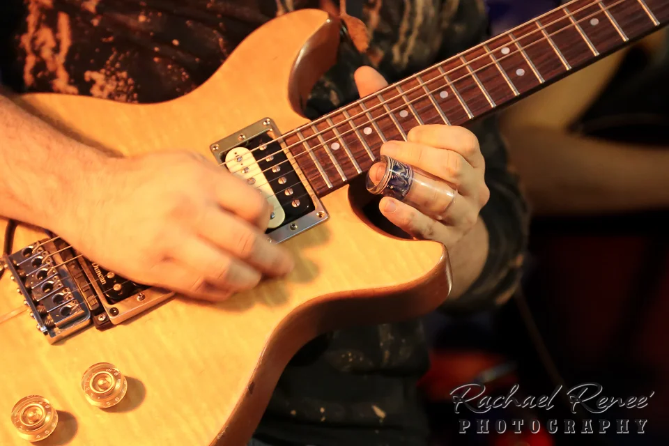 Note to self - 1/60th of a second is not fast enough to freeze a guitar player's picking hand.
