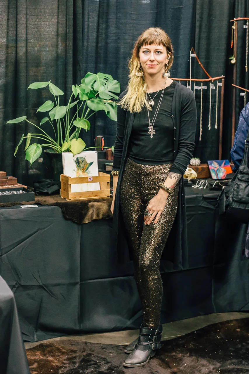 Festive, gold spangled leggings paired with black and accented with bulky gold jewlery. Win.