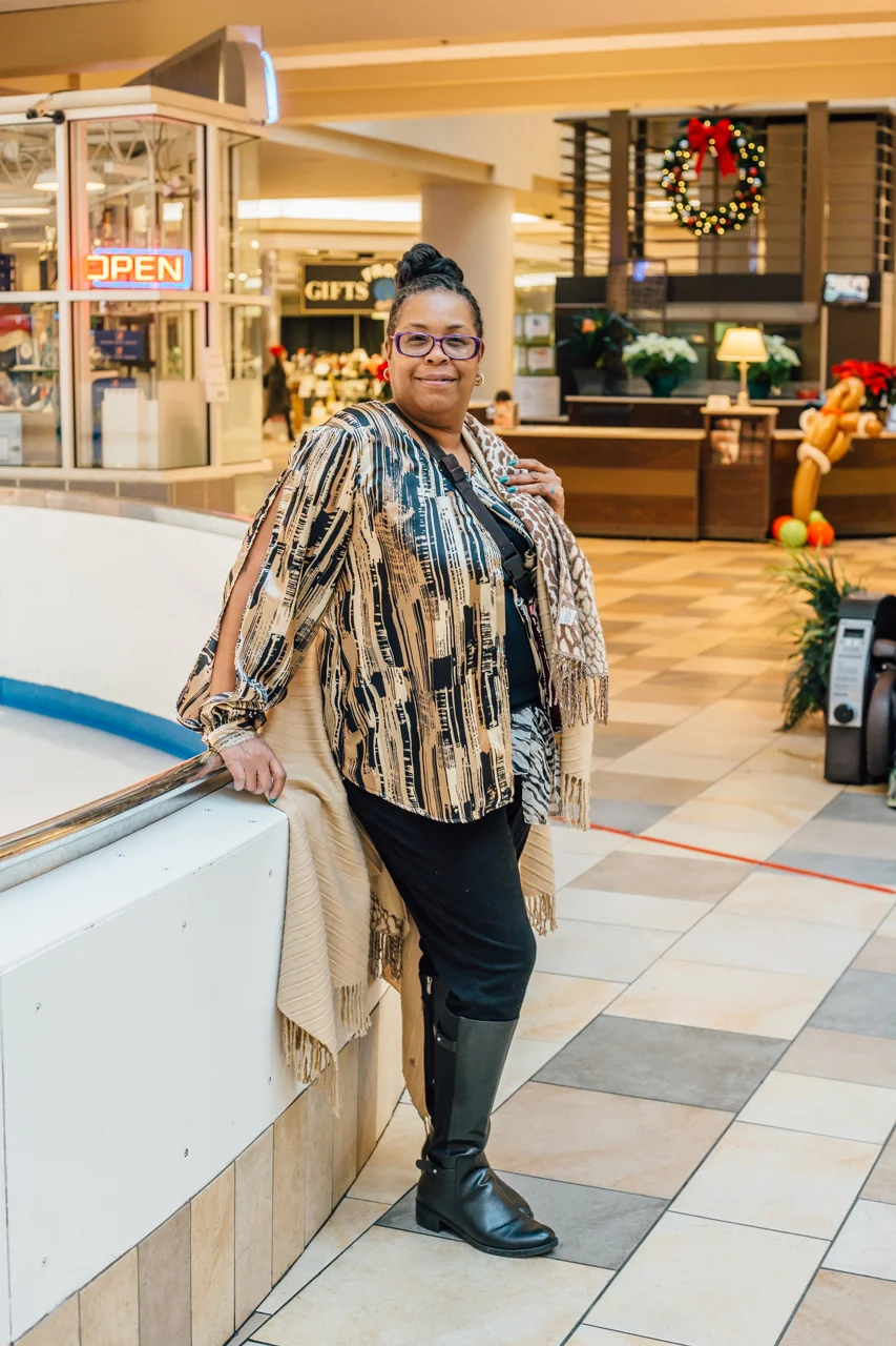 A flowy, cool top paired with a pashmina shawl for cooler weather looks great on this woman.