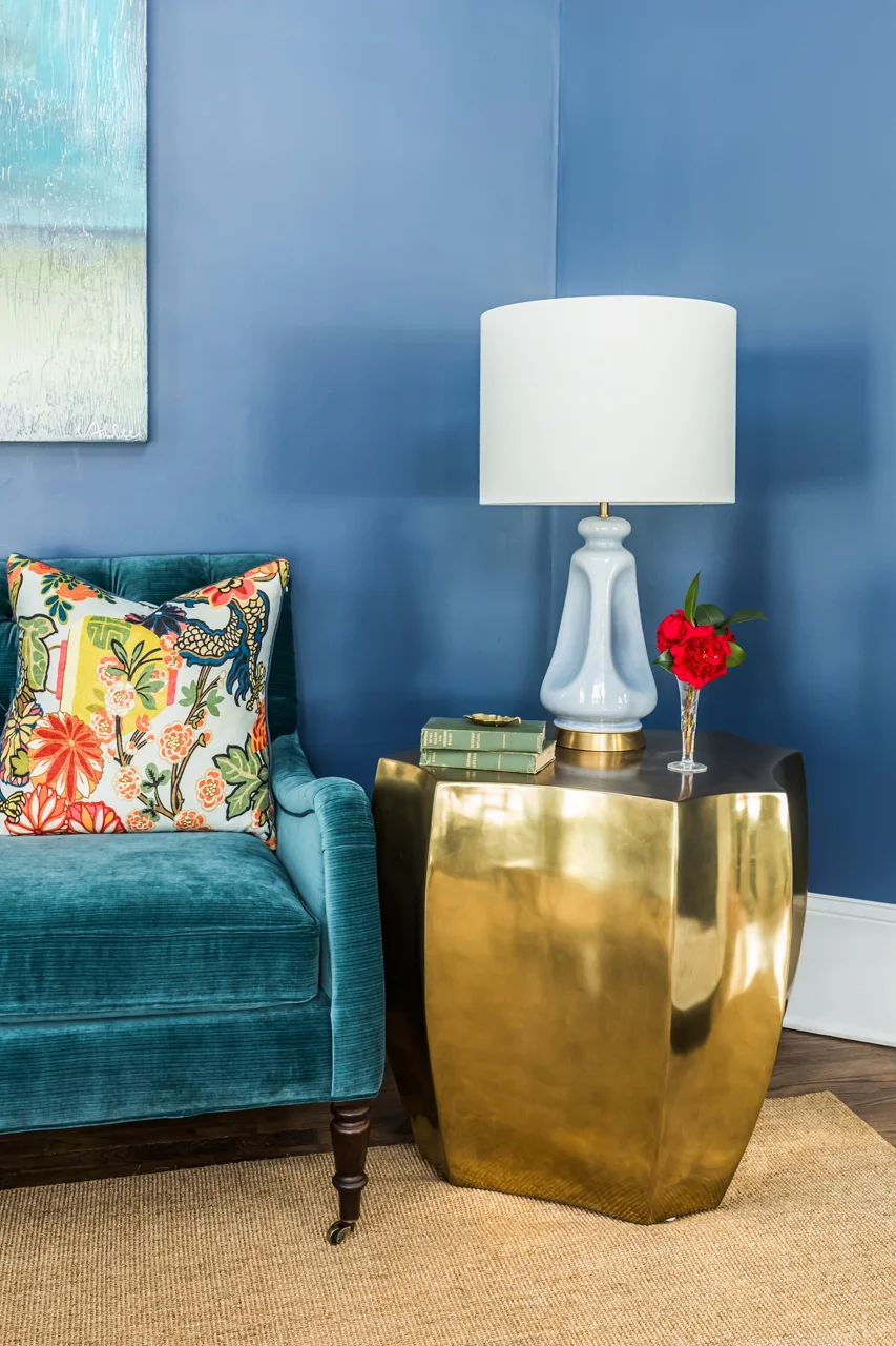 This image is a single shot of a detail of the room using natural light supplemented with my strobes in 2 places to preserve the existing shadows of the lamp on the wall and maintain dimensionality.