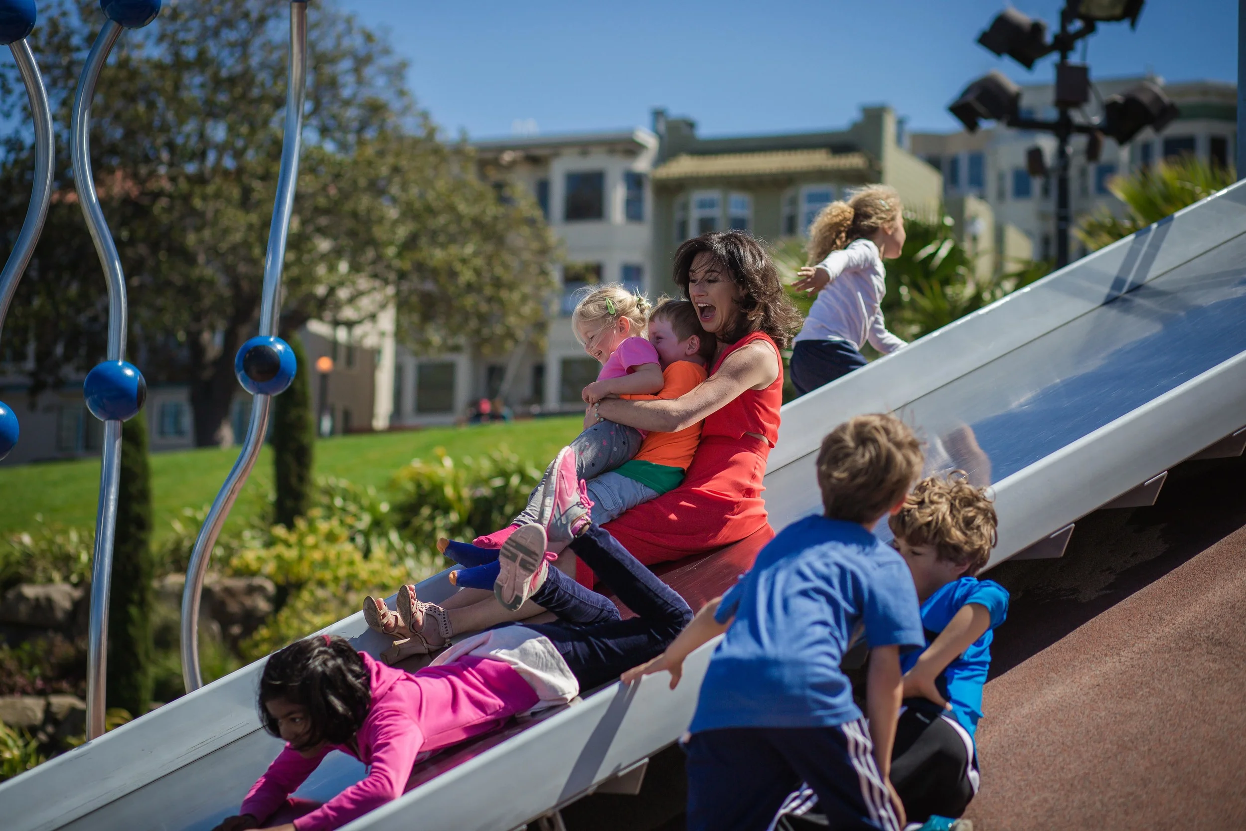 So in the middle of photos a little boy came up to Jessica, grabbed her hand and led her to the slide. This is the result. Pretty awesome!