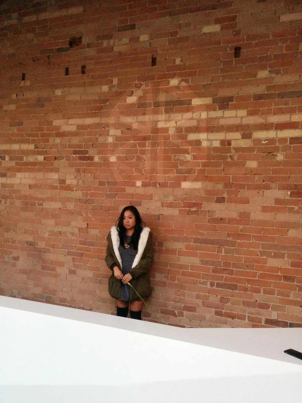   Using a portable projector to measure the dimensions of the BrainStation main lobby sign in context to the height of a person.  