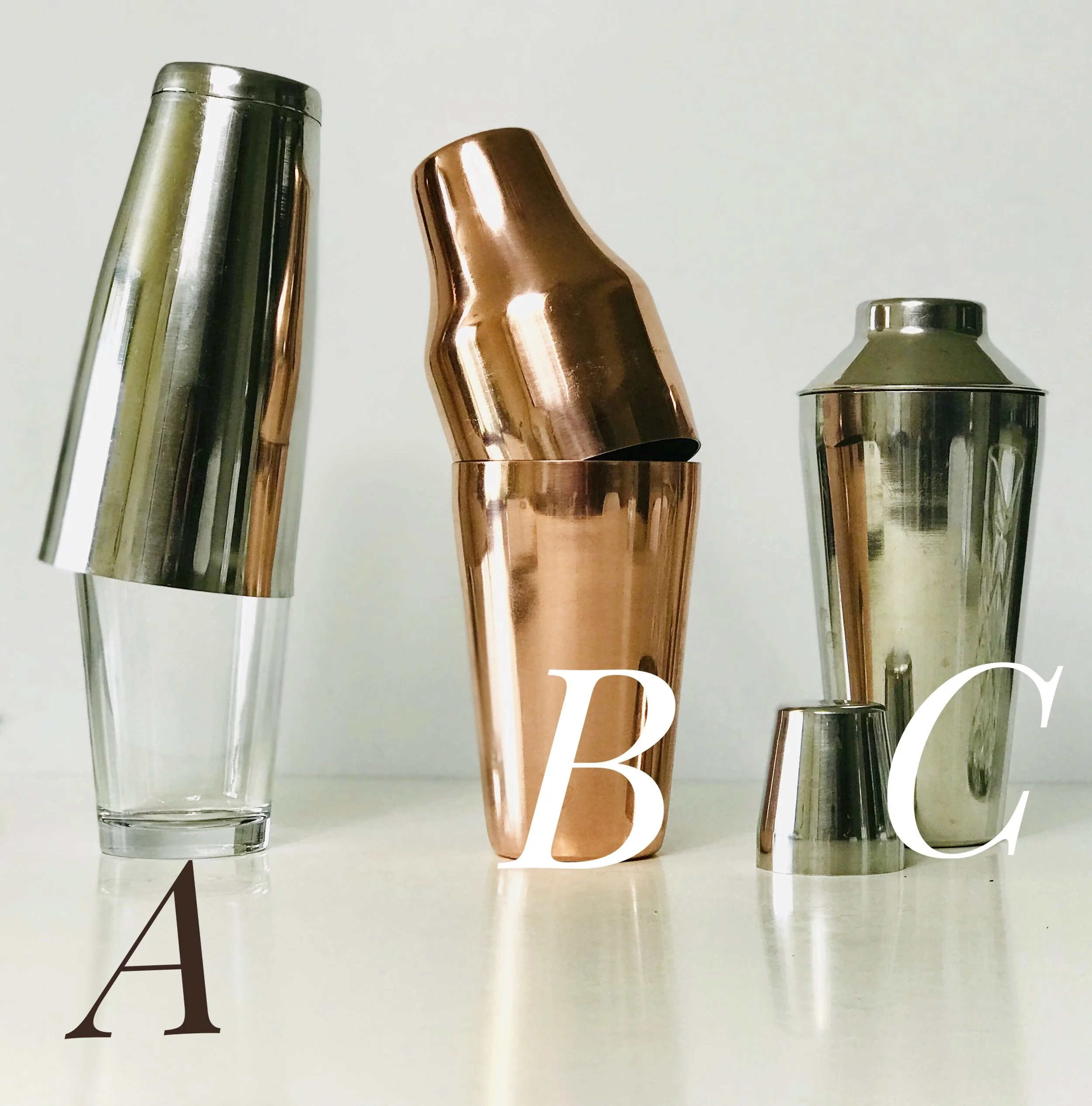 Line up of different cocktail shakers