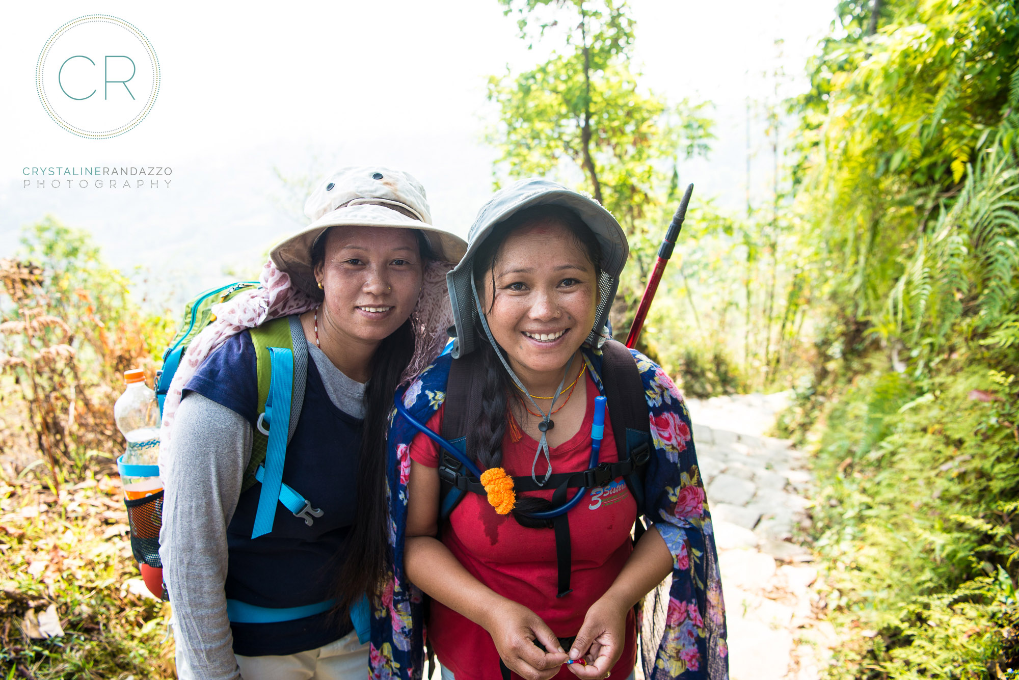Three Sister's guide Muna (in red) and my assistant guide Tukashi leading our team of three women on the Annapurna trail. 
