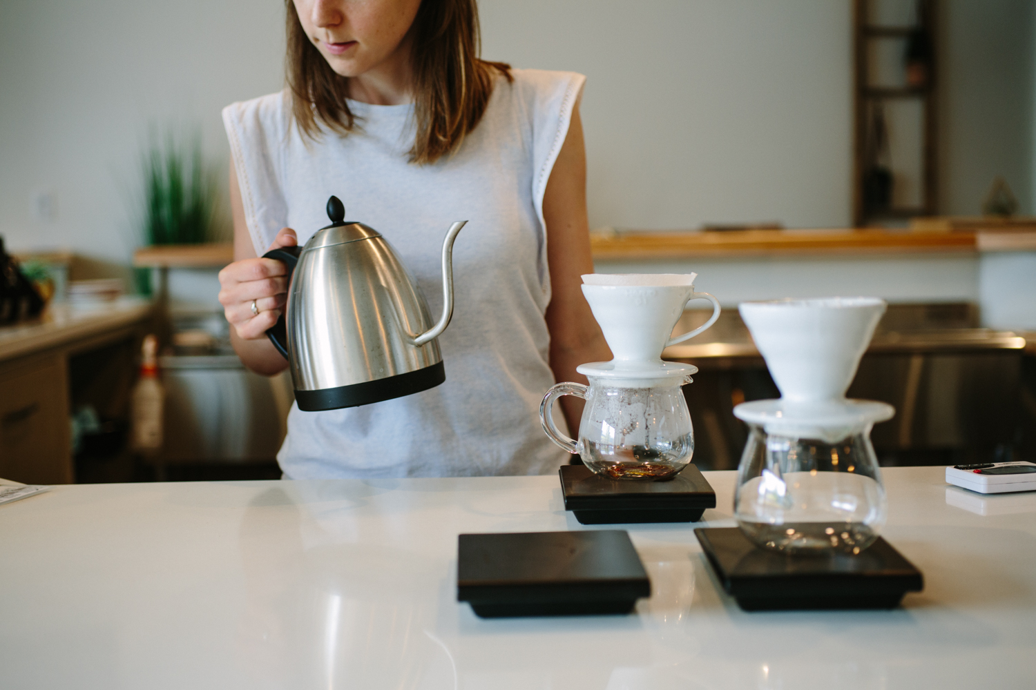 image of woman making pour over coffees